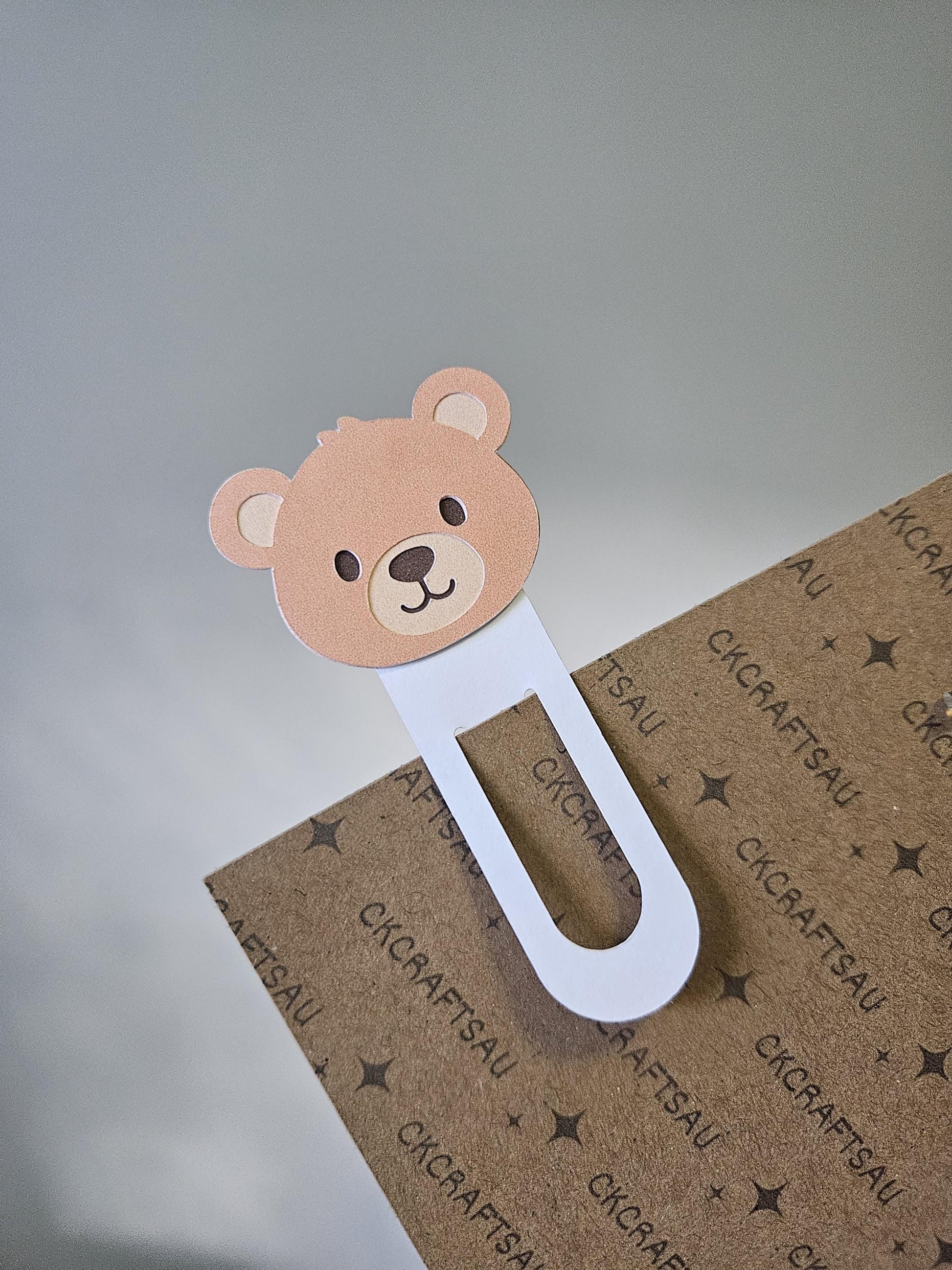 Single brown Bear Bookmark clipped onto display page