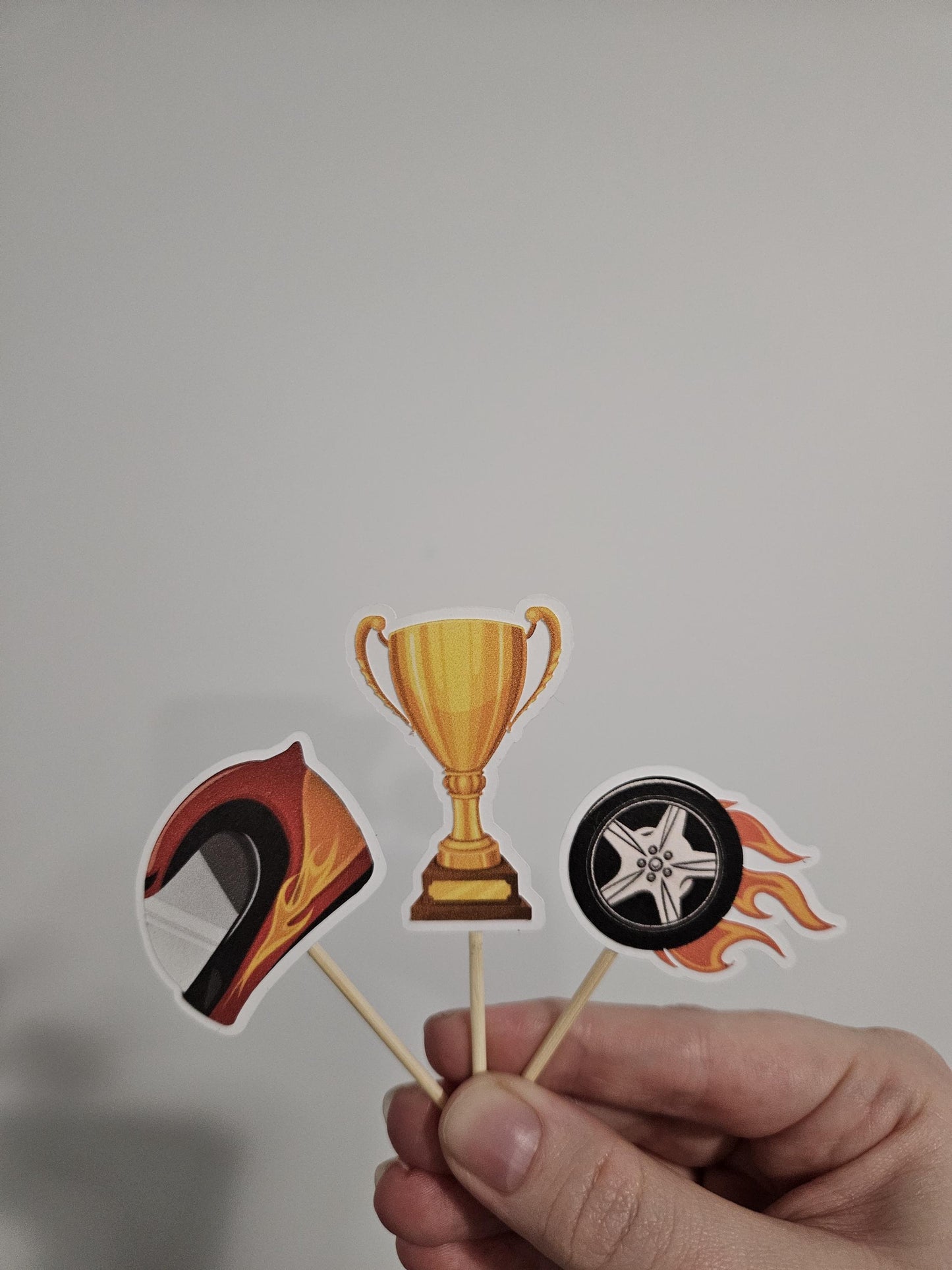 helmet, trophy and wheel toppers