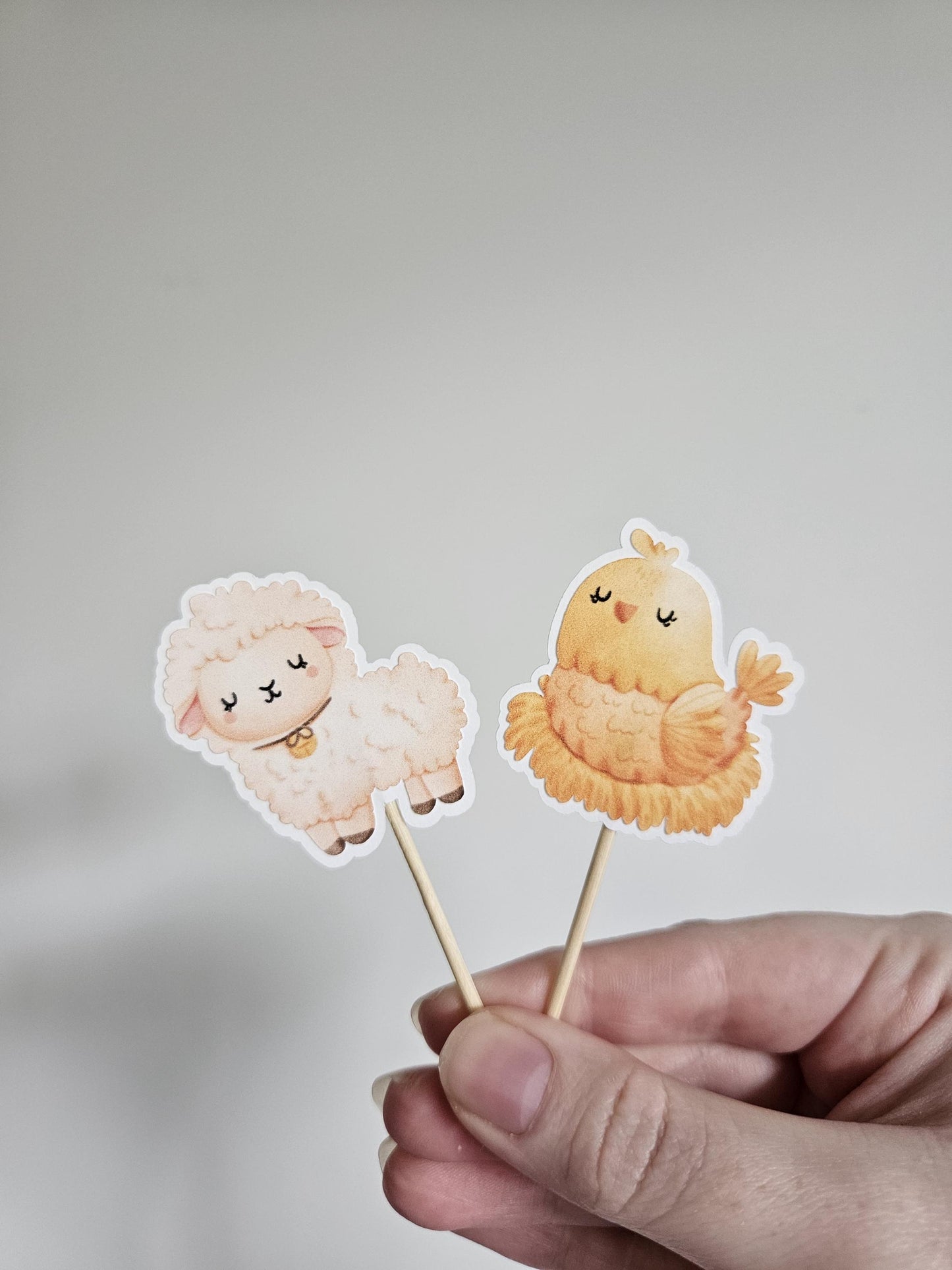 sheep and chicken cupcake toppers on white background