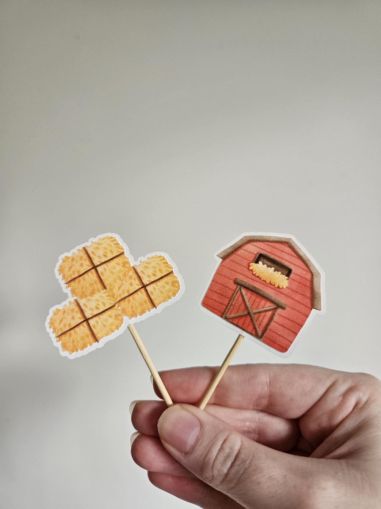 Barn and hay bale cupcake toppers on white background